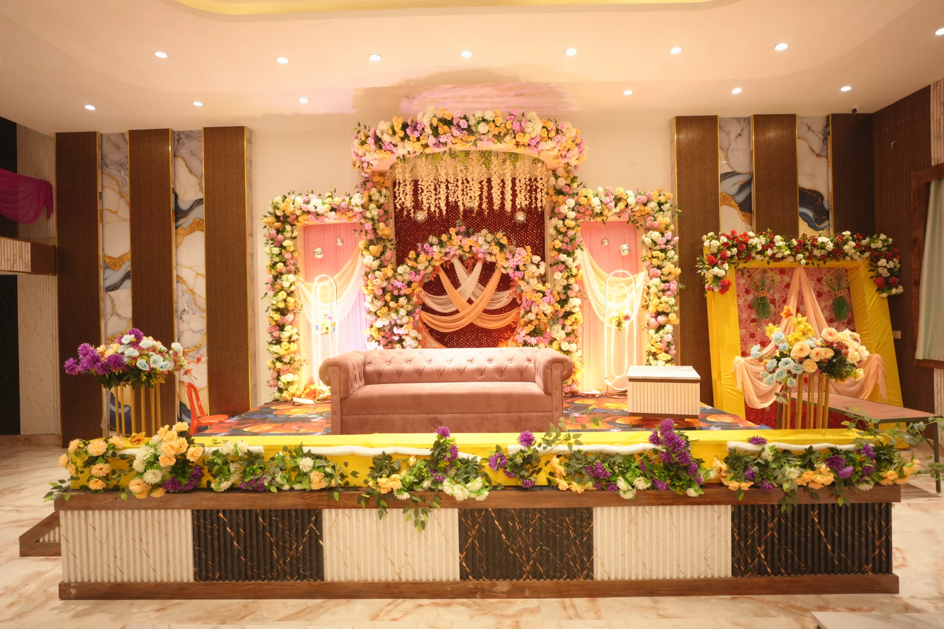 A floral stage in the banquet hall